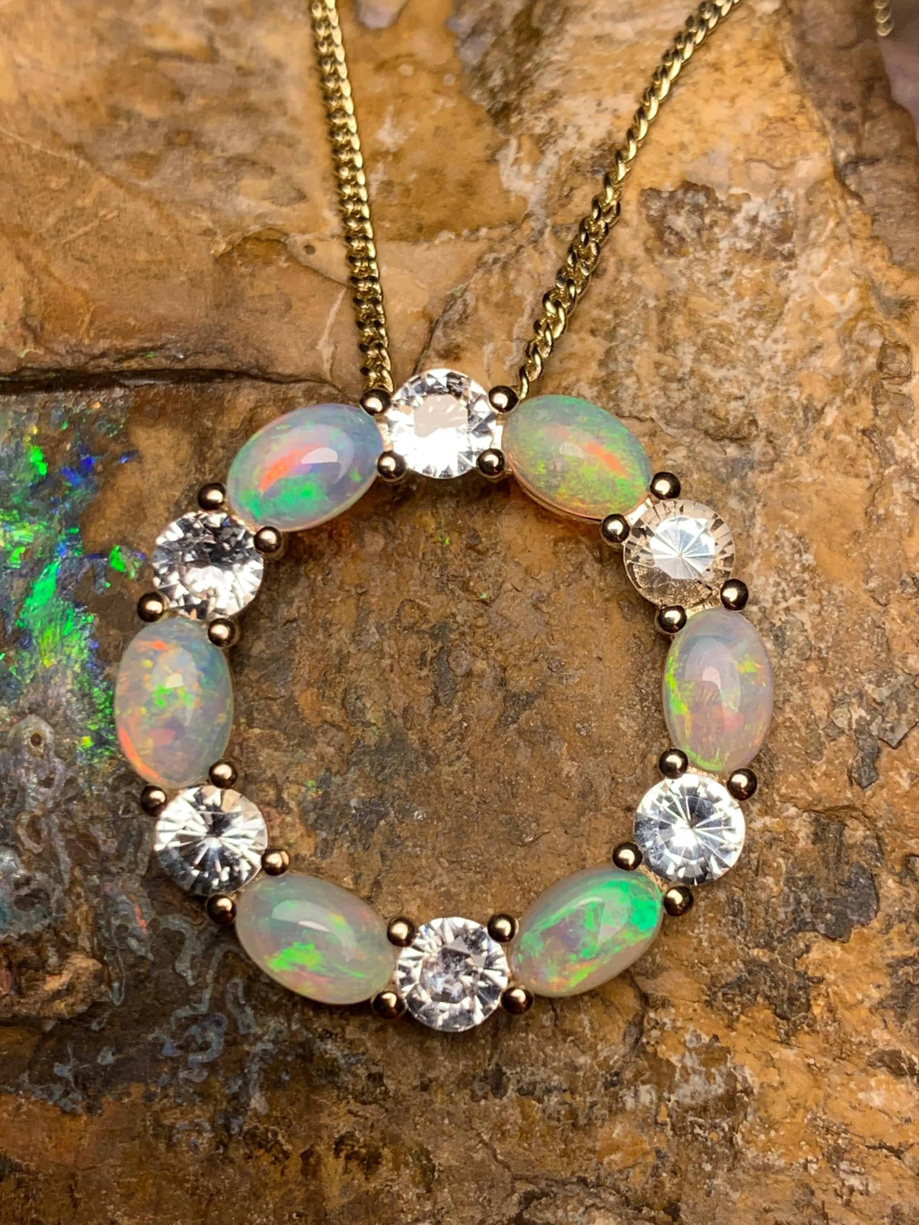 14kt Yellow Gold Circle of Life Opal and Sapphire pendant