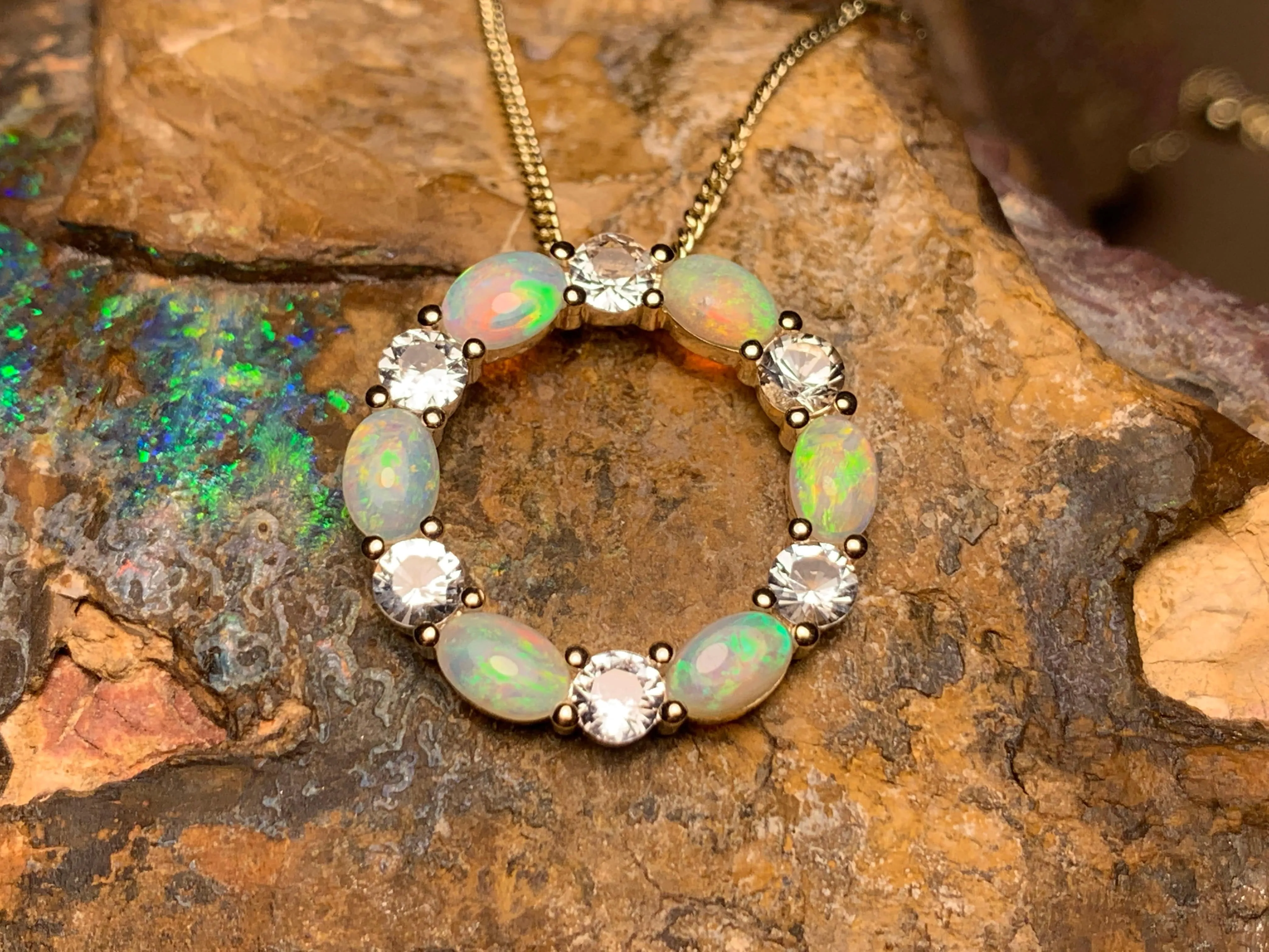 14kt Yellow Gold Circle of Life Opal and Sapphire pendant