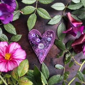 Fabric heart brooches in purples