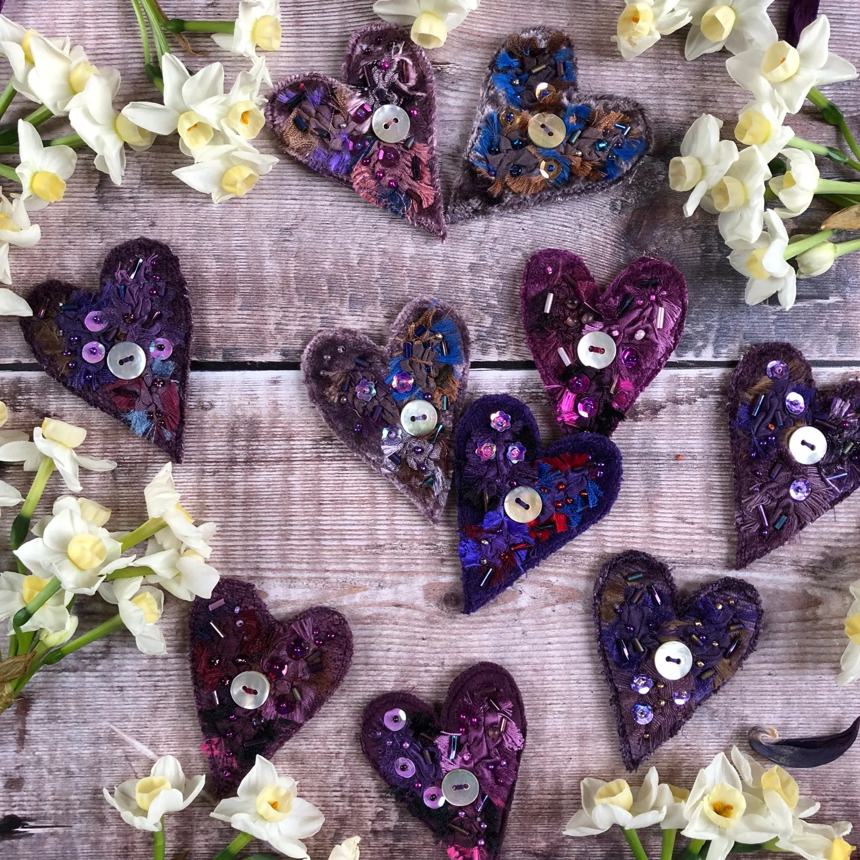Fabric heart brooches in purples