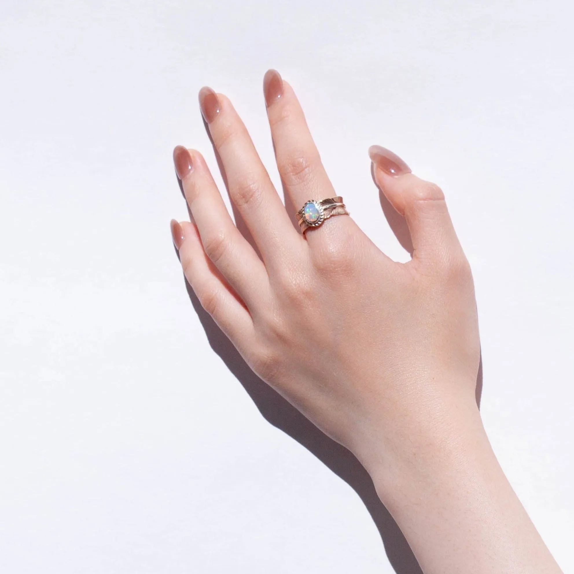 Gold large infinity feather ring with Ethiopian opal