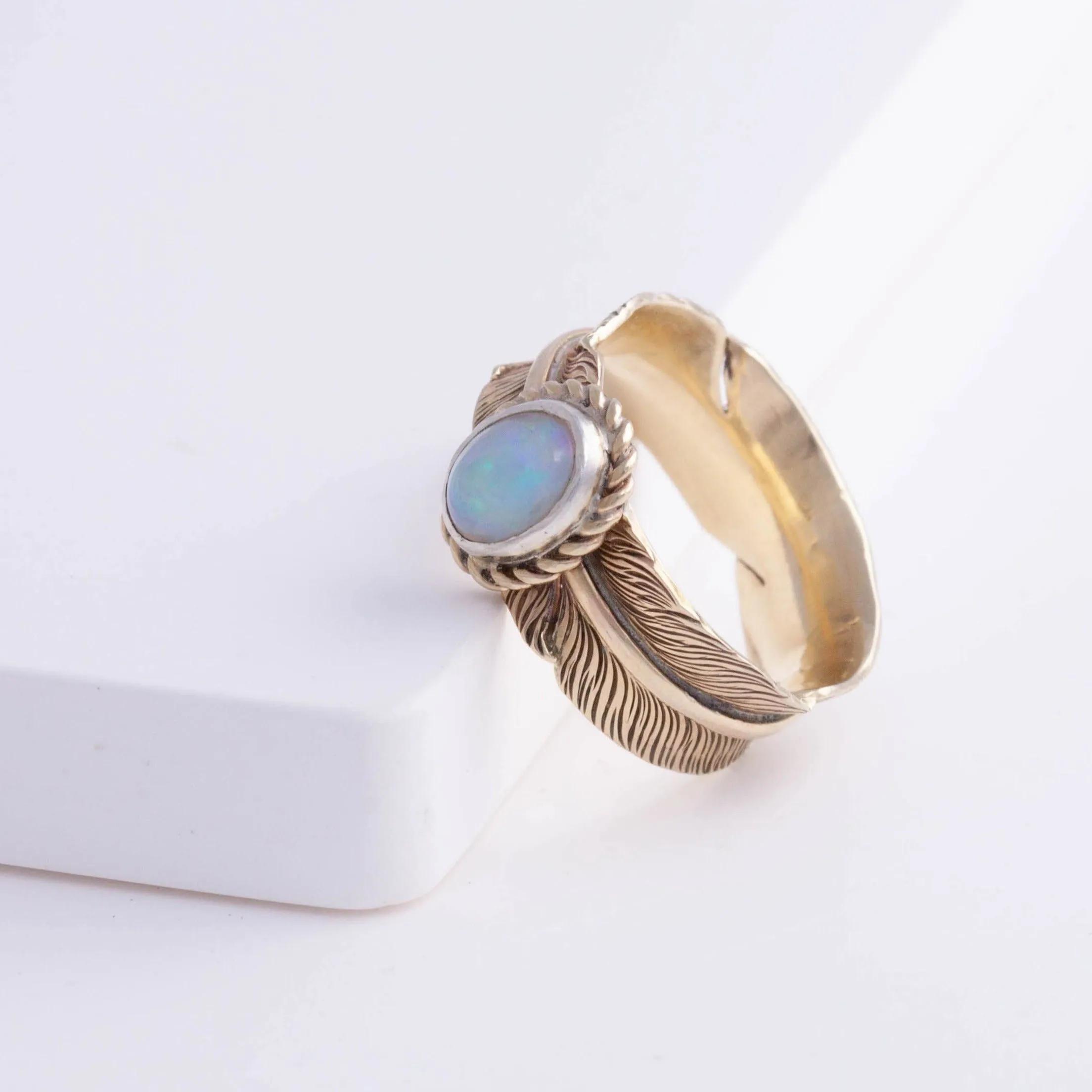 Gold large infinity feather ring with Ethiopian opal
