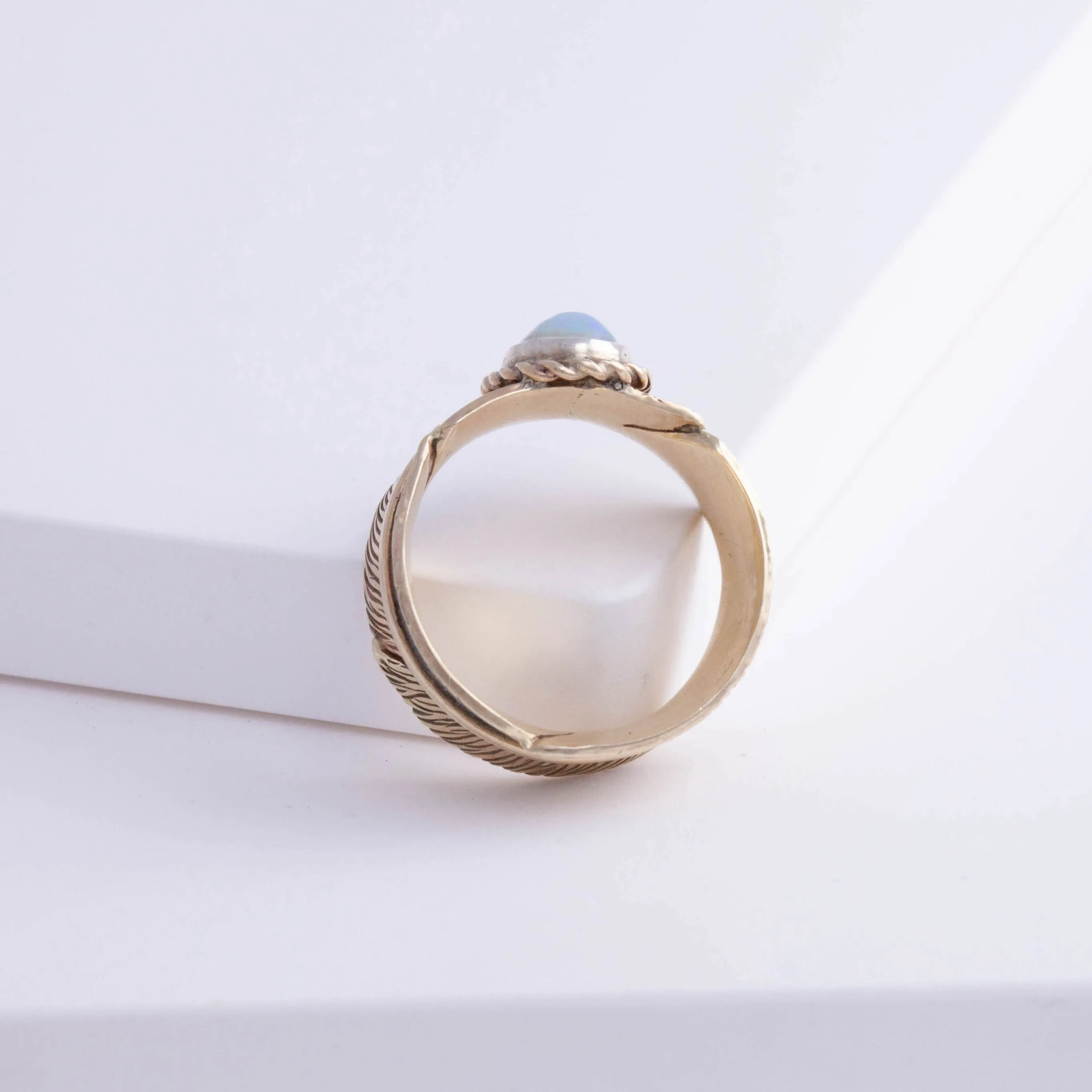 Gold large infinity feather ring with Ethiopian opal