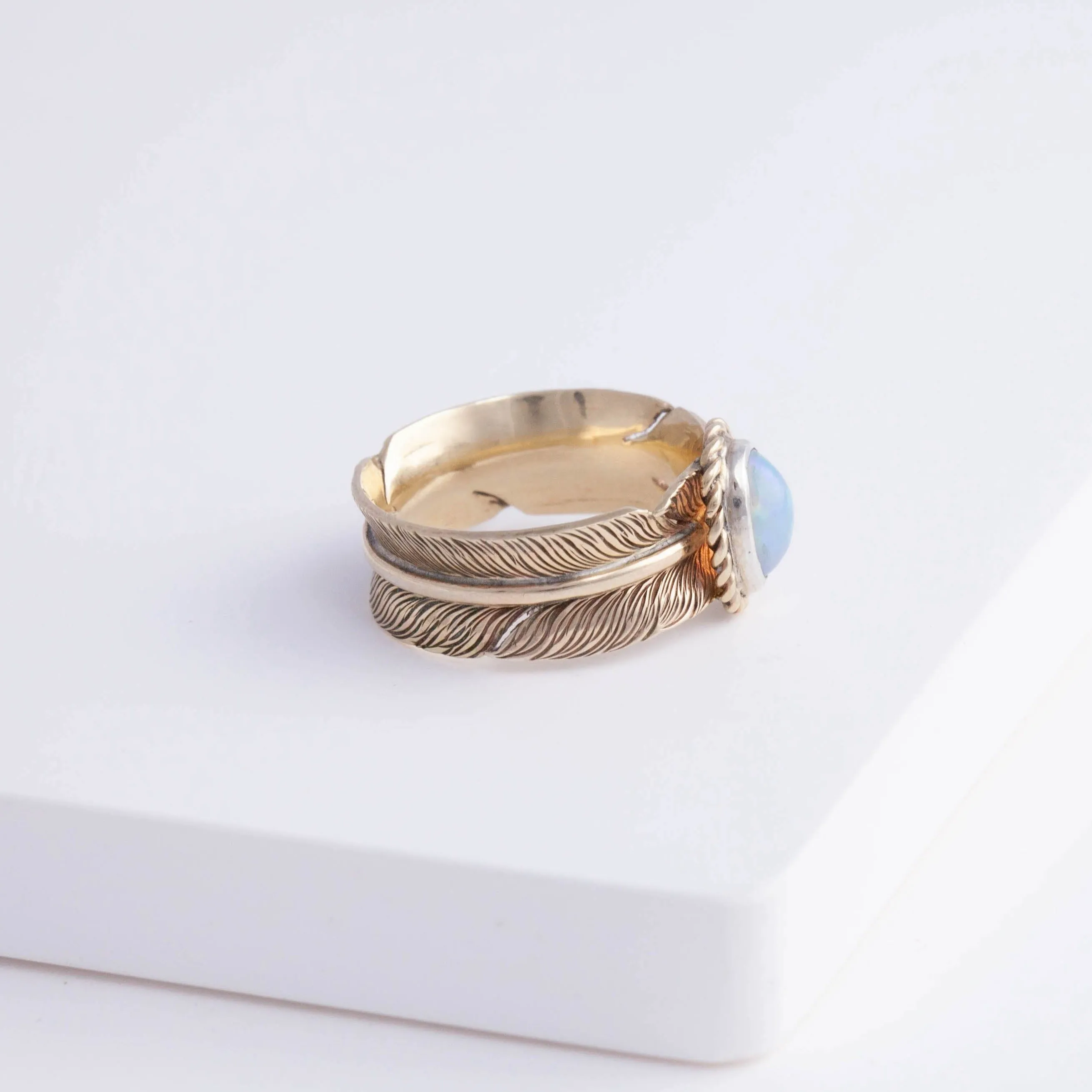 Gold large infinity feather ring with Ethiopian opal
