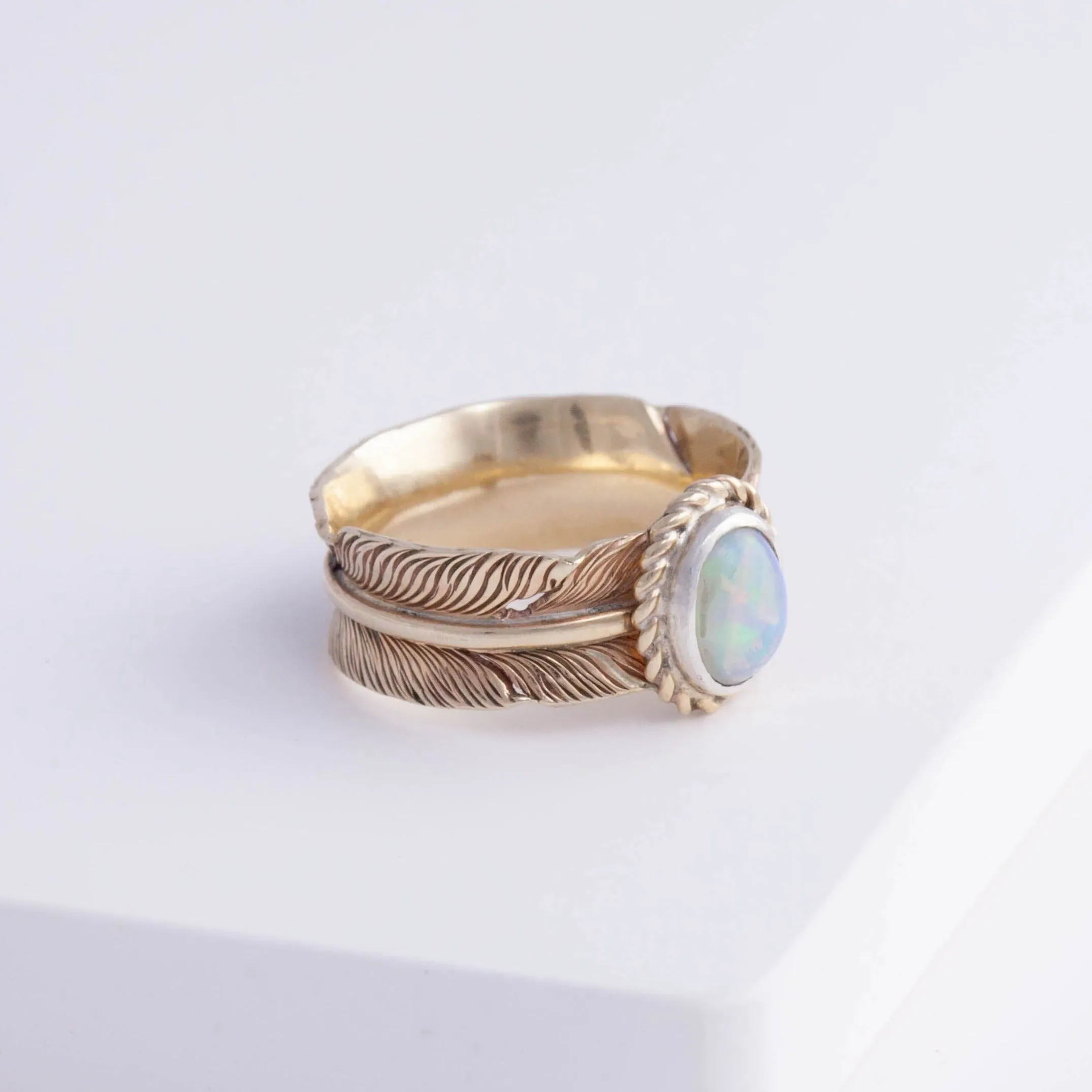 Gold large infinity feather ring with Ethiopian opal