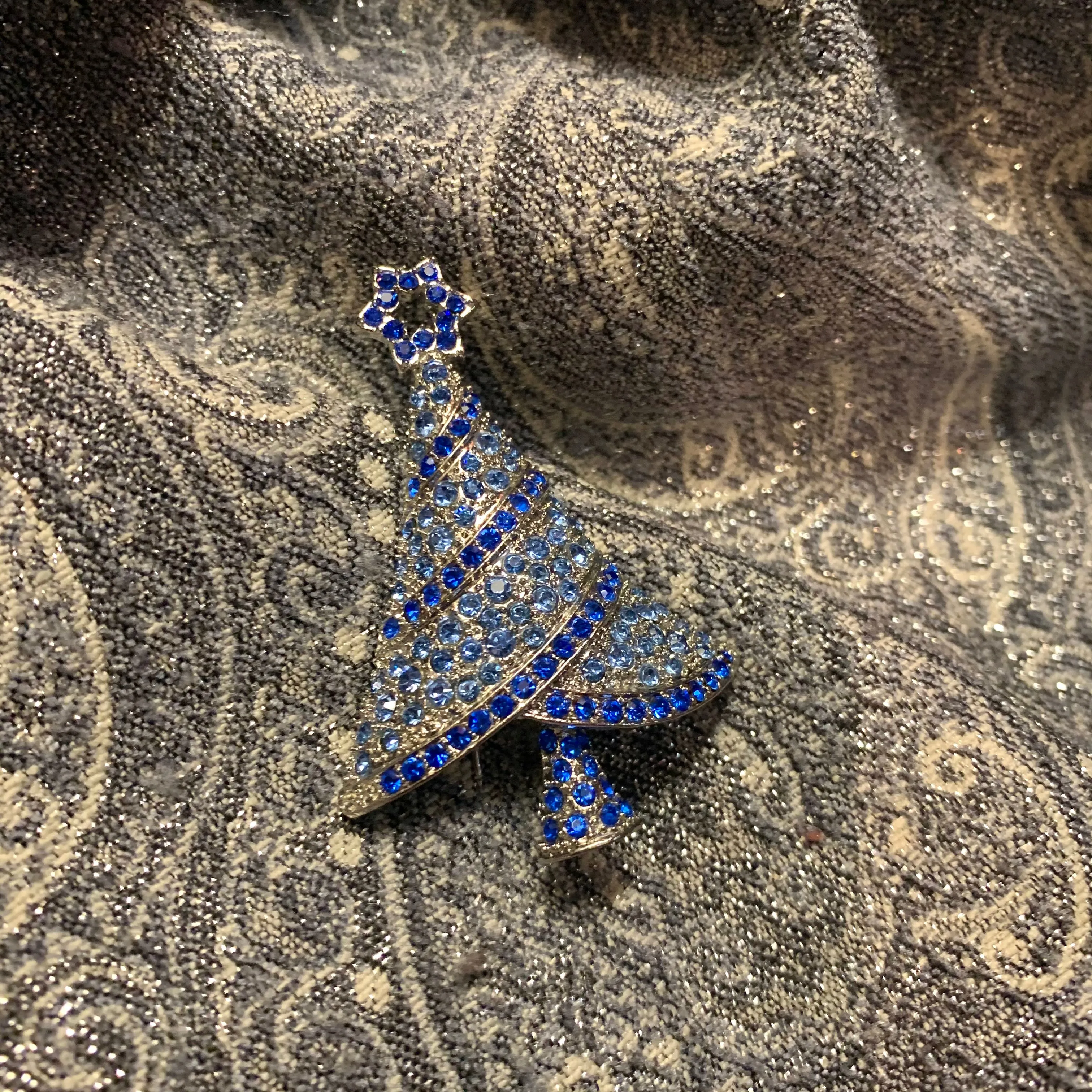 Icy Blue Christmas tree brooch with a star in gold tone.