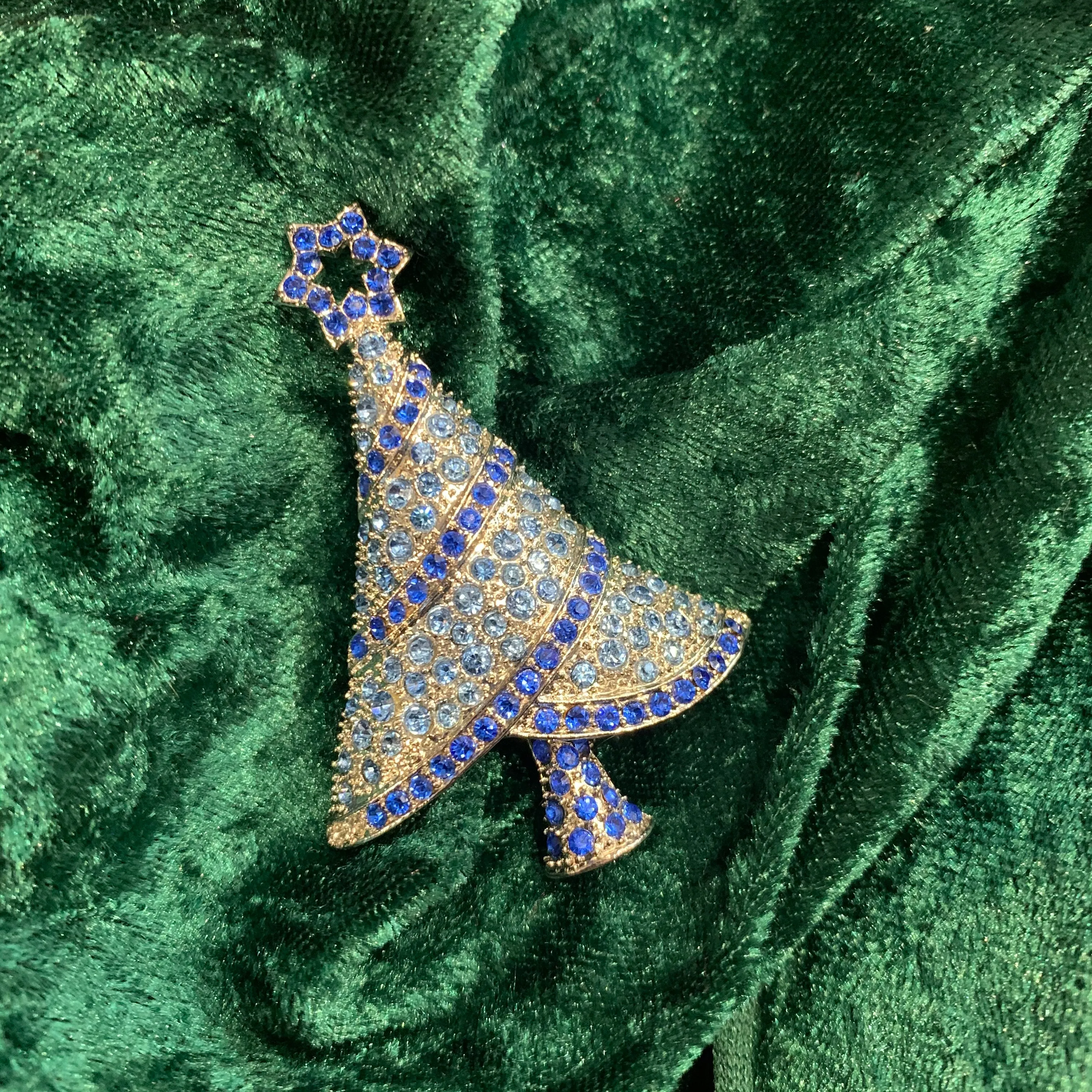 Icy Blue Christmas tree brooch with a star in gold tone.