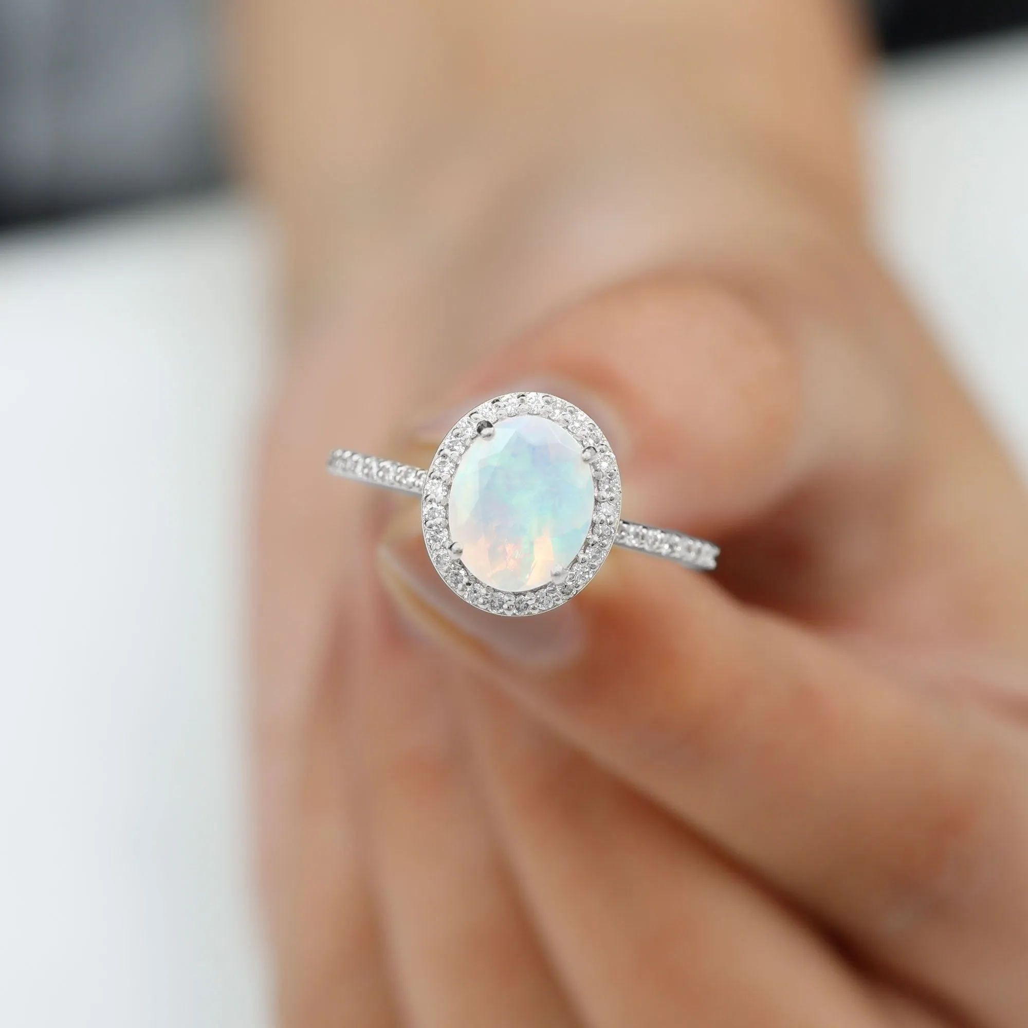 Oval Ethiopian Opal and Diamond Classic Halo Engagement Ring